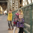 Three young walkers try out the Meridian Bridge on its reopening day as a footbridge.